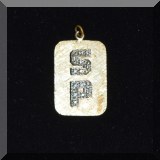 J21. Gold and diamond SP pendant.